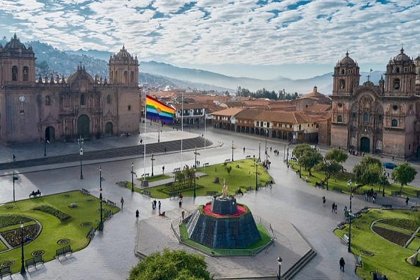 Plaza de Armas Cusco Historic Center city square with cathedral and Andes mountains Peru