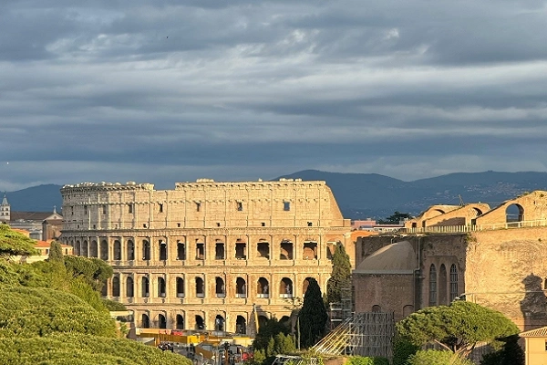 Colosseum in Rome, Italy, viewed from above under cloudy skies for UNESCO World Heritage Sites in Italy guide