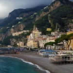 Amalfi Coast scenic view with cliffside houses, beach, and Mediterranean Sea in Italy