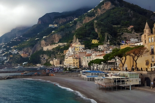 Amalfi Coast scenic view with cliffside houses, beach, and Mediterranean Sea in Italy