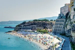 Tropea beach and cliffside town in Calabria Italy with turquoise sea and historic buildings