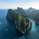 Thailand island aerial view with limestone cliffs and turquoise water in the Andaman Sea
