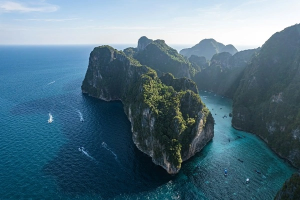 Thailand island aerial view with limestone cliffs and turquoise water in the Andaman Sea